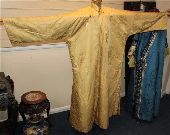 A Chinese yellow silk damask quilted robe, late 19th / early 20th century,